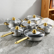 Luxury Non-Stick Cookware Set with Glass Lids featuring black pots and pans with gold-tone handles and tempered glass lids