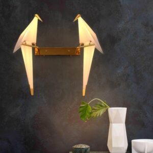 Origami bird wall light with artistic dual bird design and warm ambient illumination.