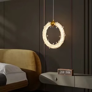 Crystal halo ring pendant light with sparkling crystal-inspired detailing and elegant circular design.