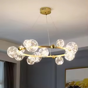 Celestial bubble ring chandelier with illuminated crystal-inspired glass globes and a circular gold frame.